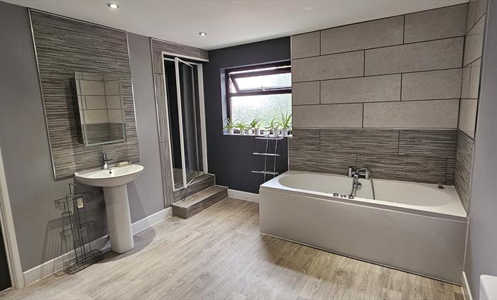 The Redford Cwtch Lounge – a cosy, welcoming space with soft seating, warm lighting, and rustic charm, perfect for relaxing with family or friends aft